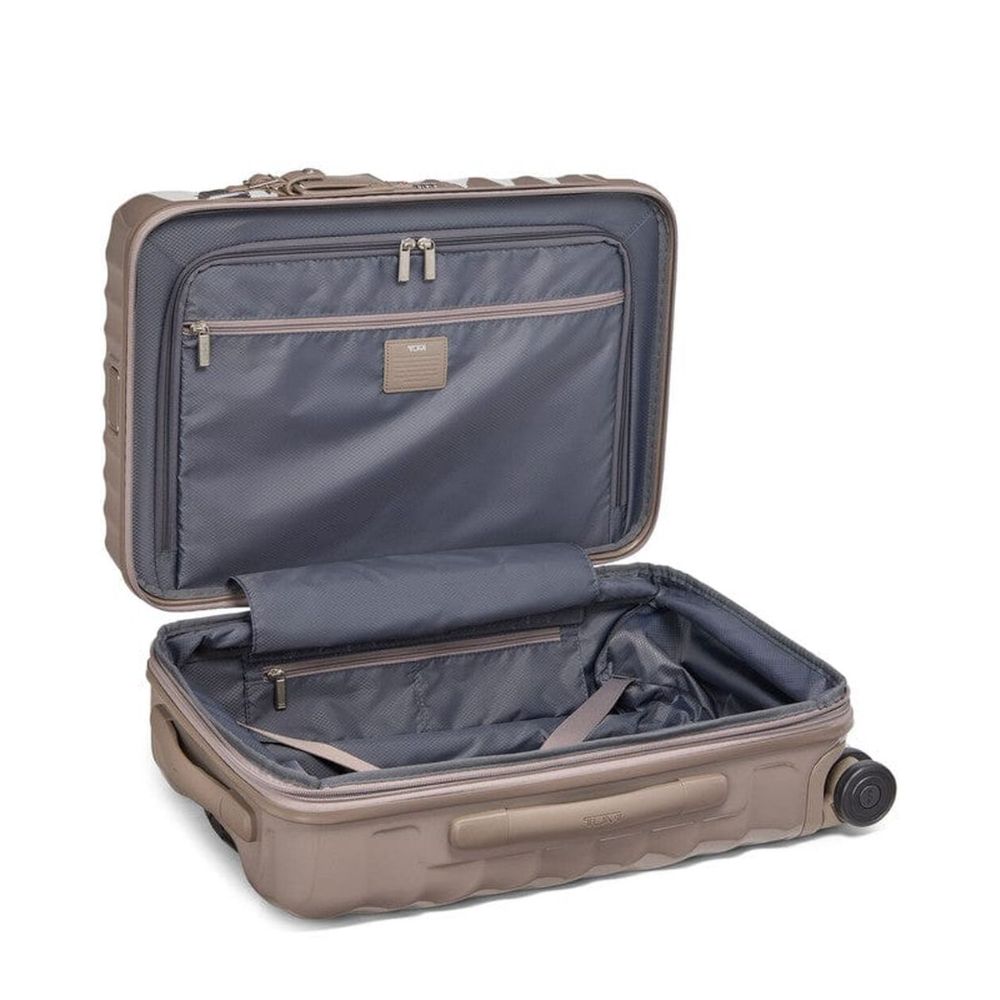 Open beige suitcase with a visible brand logo on a white background
