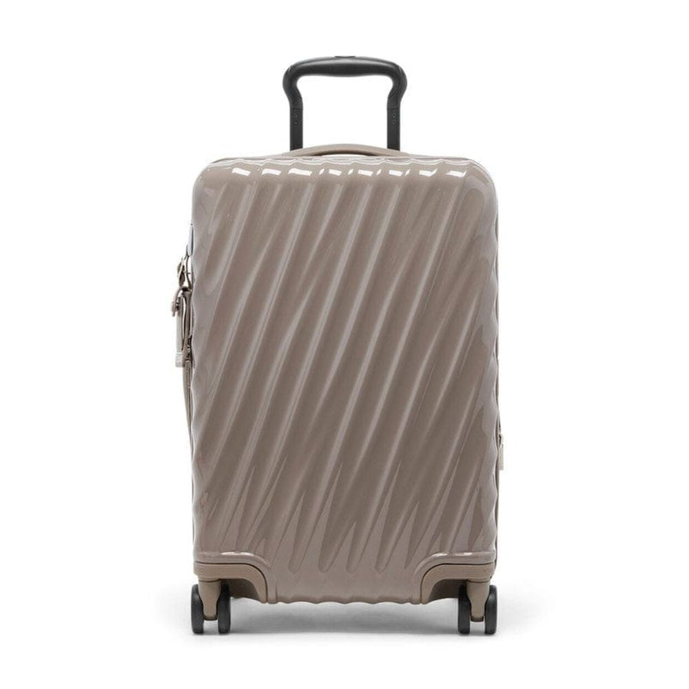 Beige suitcase with a black handle on a white background