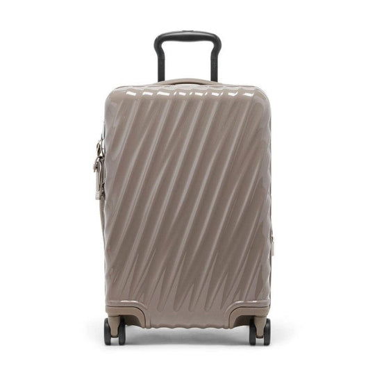 Beige suitcase with a black handle on a white background