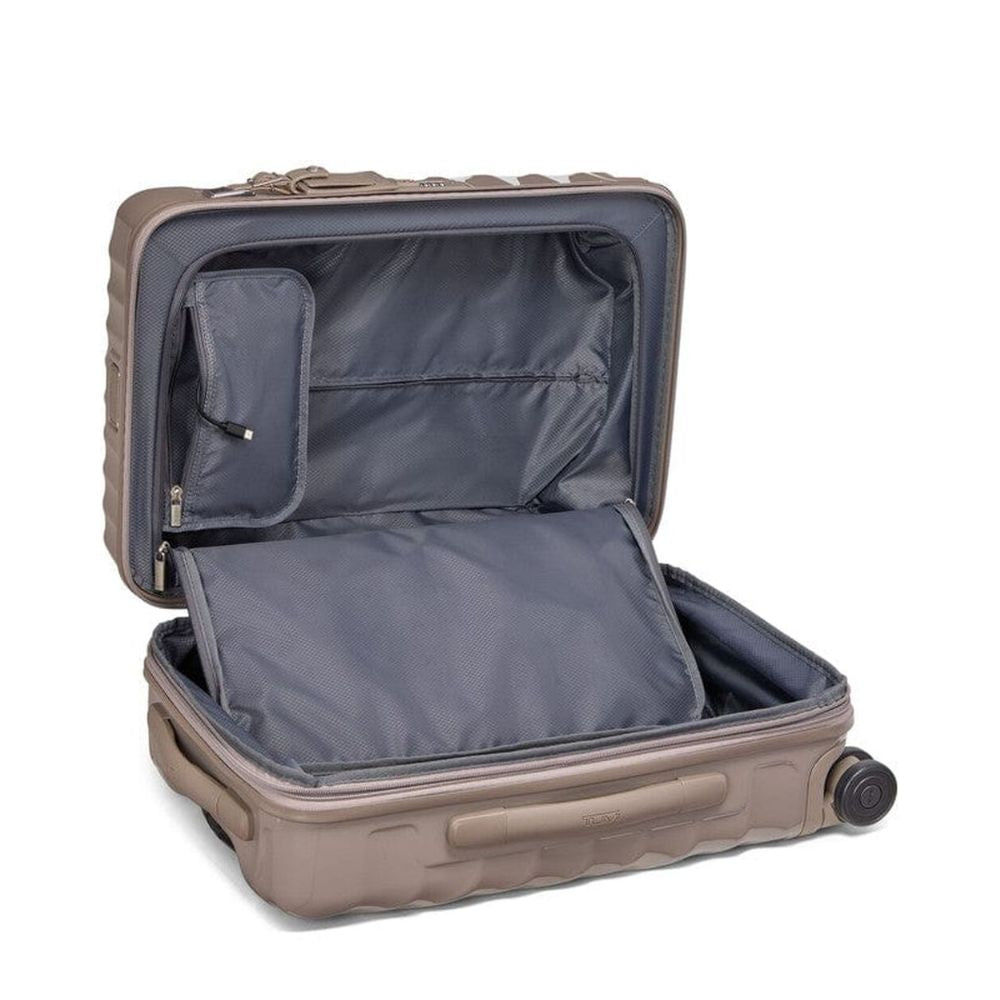 Open beige suitcase with a white background