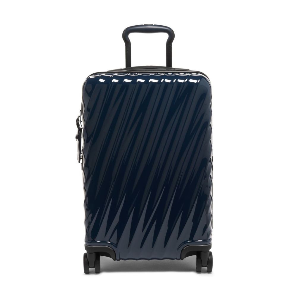 Navy blue suitcase with diagonal stripes on a white background