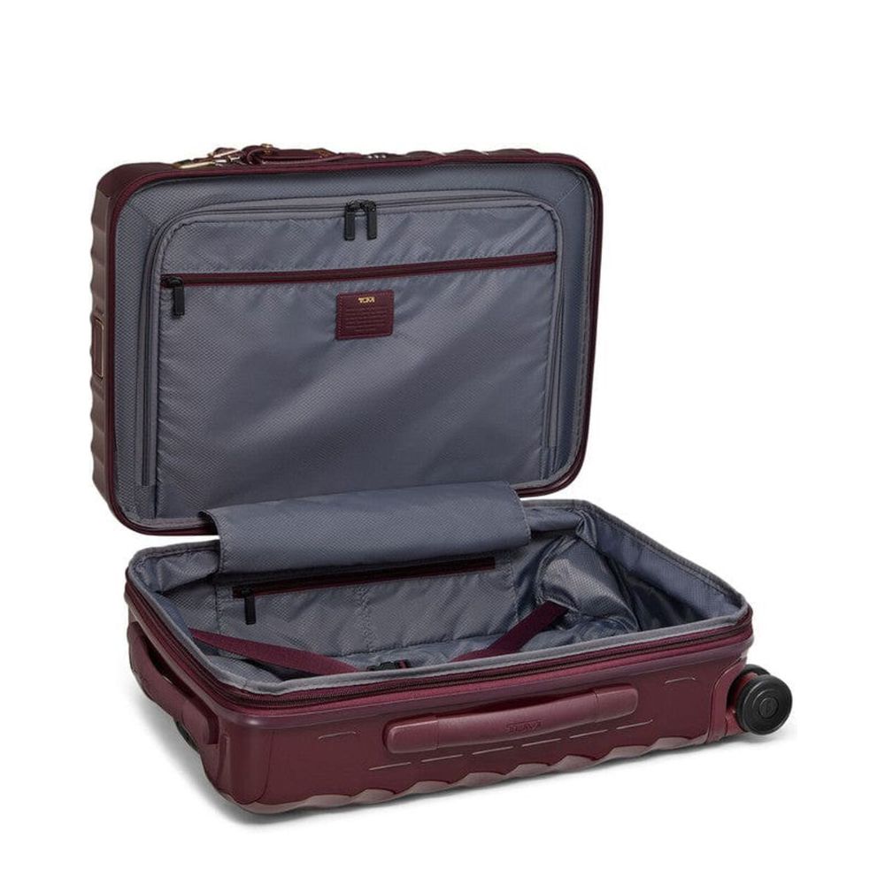 Open maroon suitcase with gray interior on a white background
