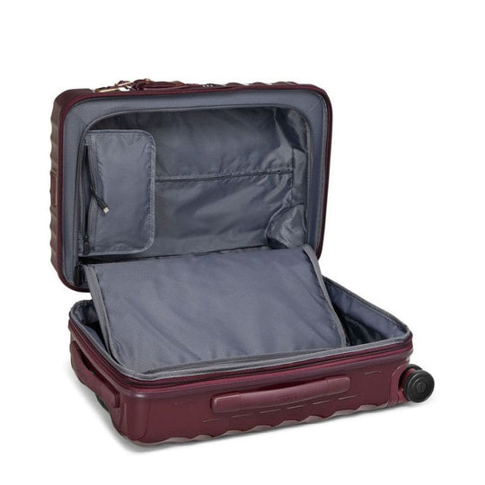 Open burgundy suitcase with a white background
