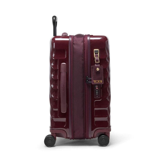 Maroon suitcase with wheels and handle on a white background