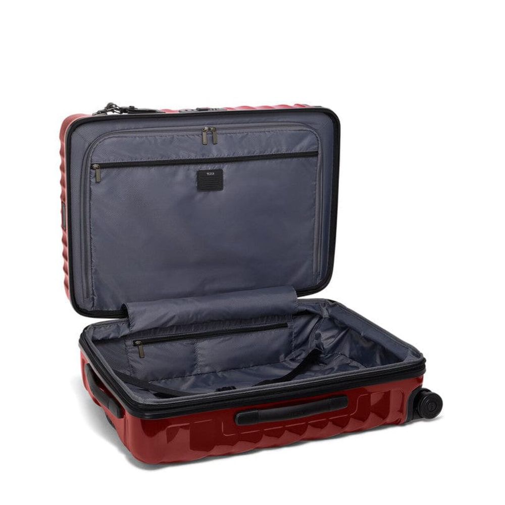 Red suitcase with open compartment on a white background