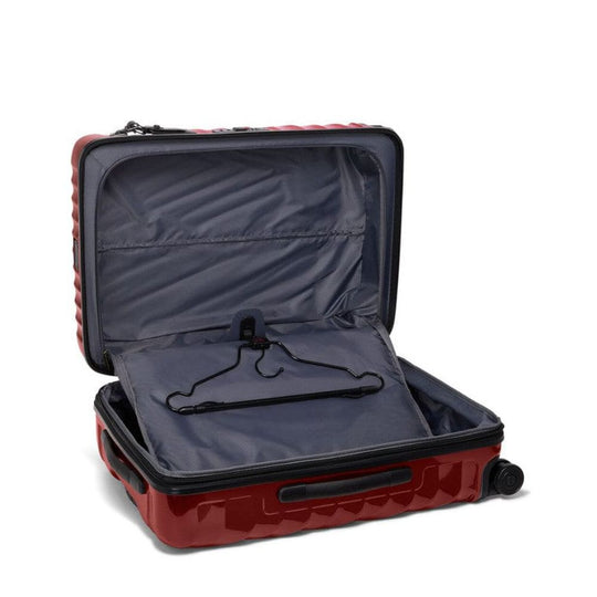 Open red suitcase with a hanger inside on a white background