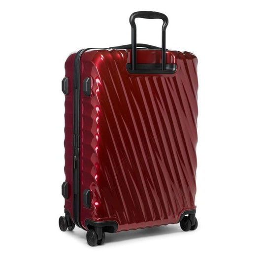Red suitcase with a textured surface on a white background