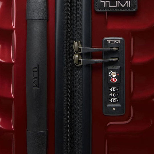 Close up of the combination lock on Red TUMI 19 Degree Expandable Case 139685-1596