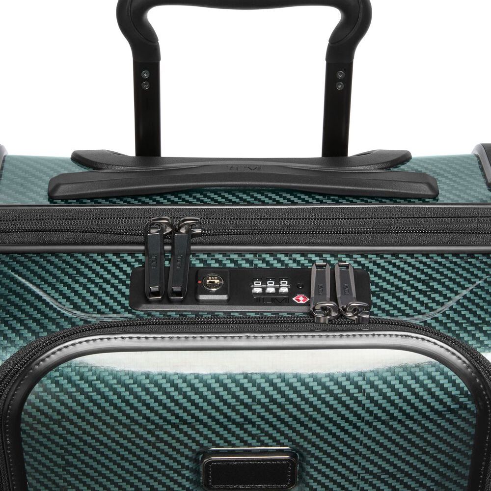 Close-up of a teal suitcase with a black handle and zipper details.