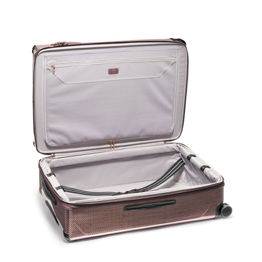 Open suitcase with interior visible on a white background