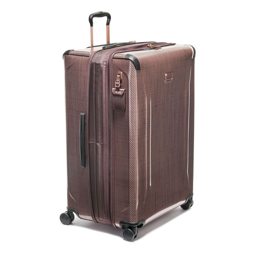 Brown suitcase with wheels and handle on a white background