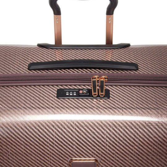 Close-up of a handle and combination lock on Blush Variant of TUMI Tegra-Lite Extended Packing Case With USB-C And Spinner Wheels: Model Number 144794-1060 