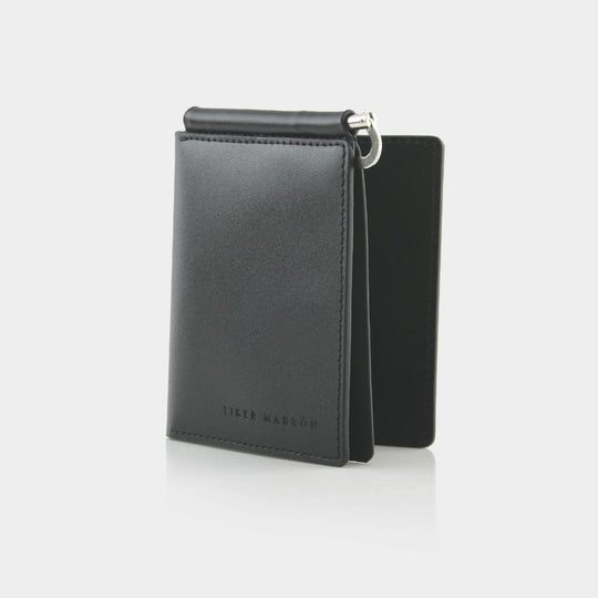 Black leather wallet with zipper on a white background
